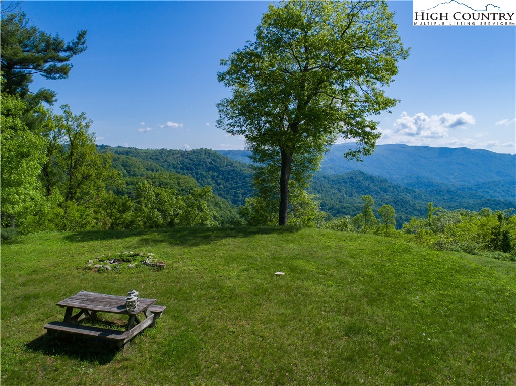 Storie Road Deep Gap, NC 28618 - Photo 5 of 27 a backyard of a house with table and chairs