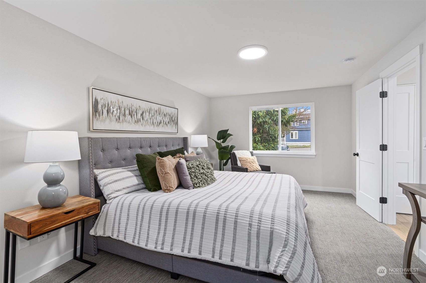 2412 Northwest 64th Street Seattle, WA 98107 - Photo 21 of 31 a bedroom with a bed and window