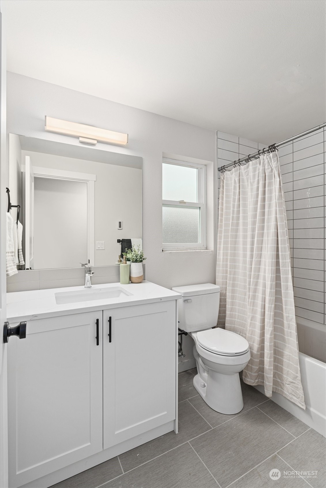 2412 Northwest 64th Street Seattle, WA 98107 - Photo 29 of 31 a bathroom with a sink toilet and shower