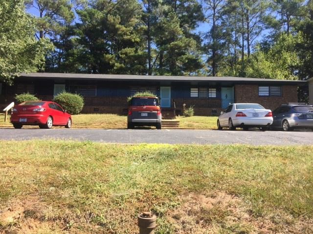 1121 Carlton Avenue Raleigh, NC 27606 - Photo 1 of 14 a view of a car parked in the road