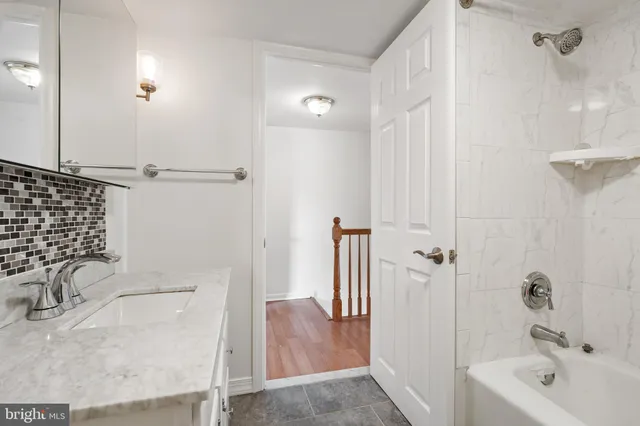 a bathroom with a sink and a tub