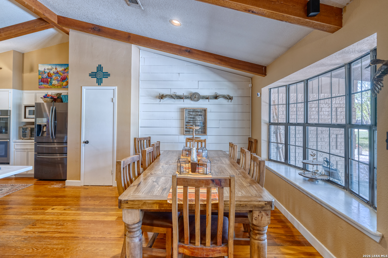 160 Beavers Trail Uvalde, TX 78801 - Photo 14 of 53 a view of a dining room with furniture window and wooden floor