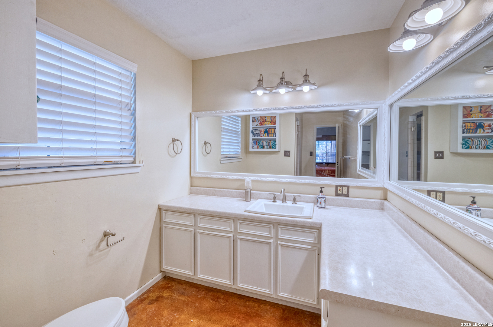 160 Beavers Trail Uvalde, TX 78801 - Photo 18 of 53 a spacious bathroom with a granite countertop sink mirror and bathtub