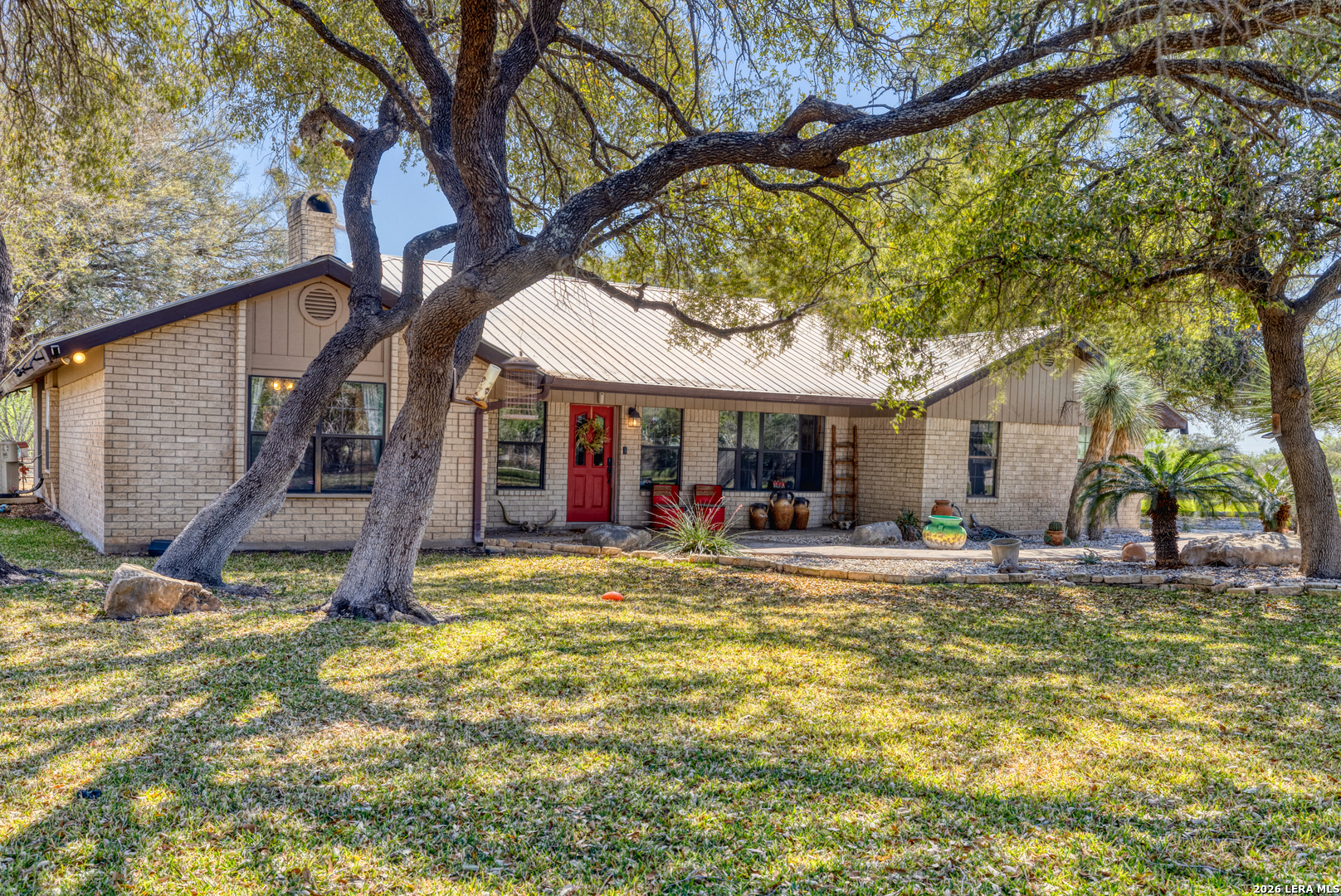 160 Beavers Trail Uvalde, TX 78801 - Photo 2 of 53 a view of a house with a large tree and a big yard