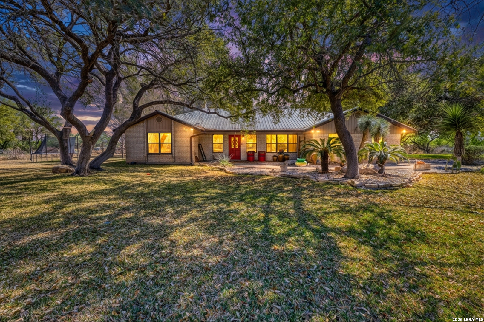 160 Beavers Trail Uvalde, TX 78801 - Photo 27 of 53 a front view of a house with a yard