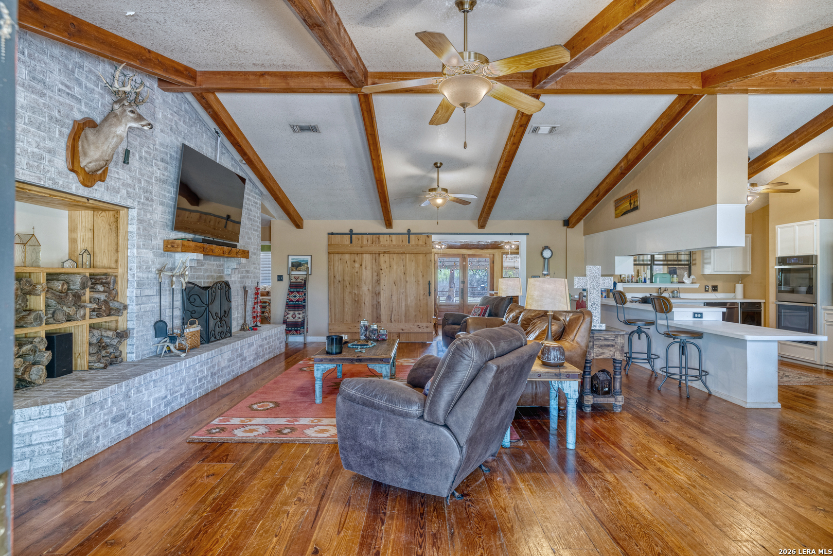160 Beavers Trail Uvalde, TX 78801 - Photo 5 of 53 a living room with furniture and a fireplace