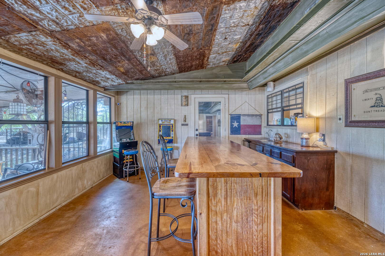 160 Beavers Trail Uvalde, TX 78801 - Photo 9 of 53 a dining room with furniture and a floor to ceiling window