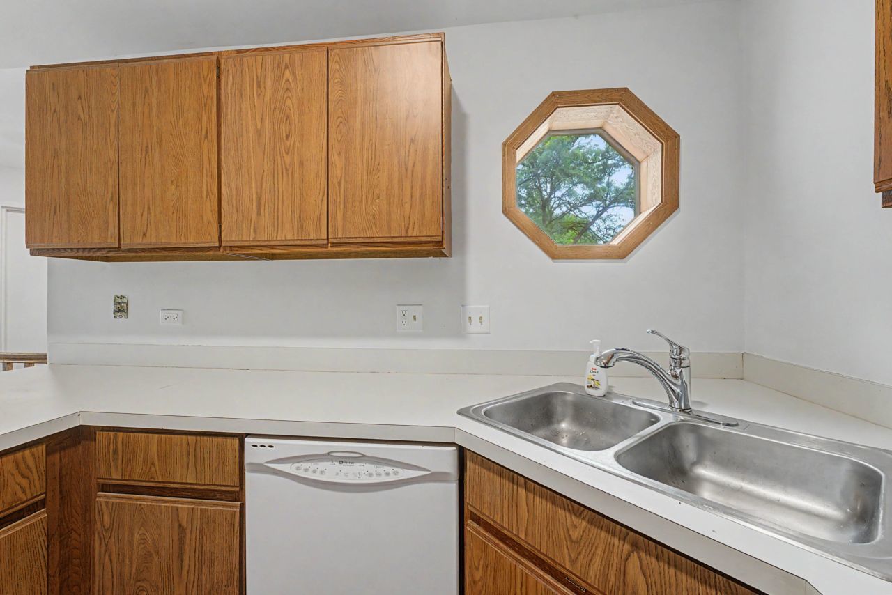 1953 North Coldspring Road Arlington Heights, IL 60004 - Photo 15 of 27 a kitchen with a sink and a window