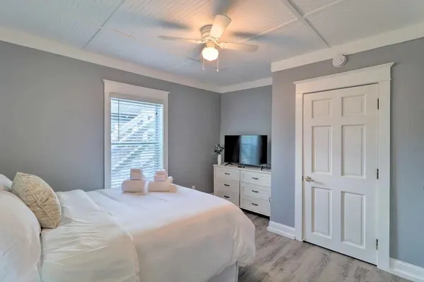 a front view of a house with a garden