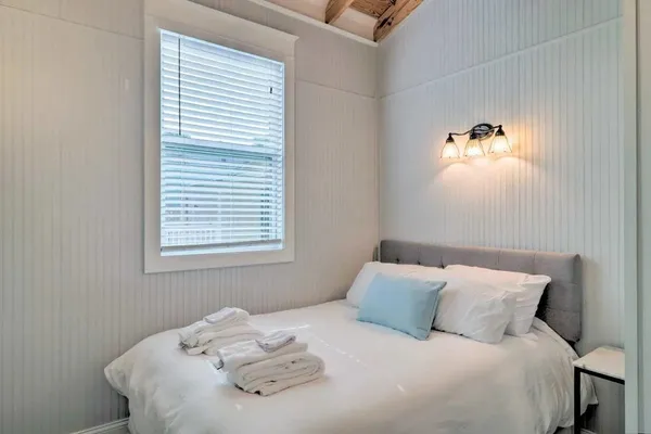 a view of a backyard with a large tree