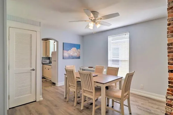 a view of a dining room with furniture and wooden floor
