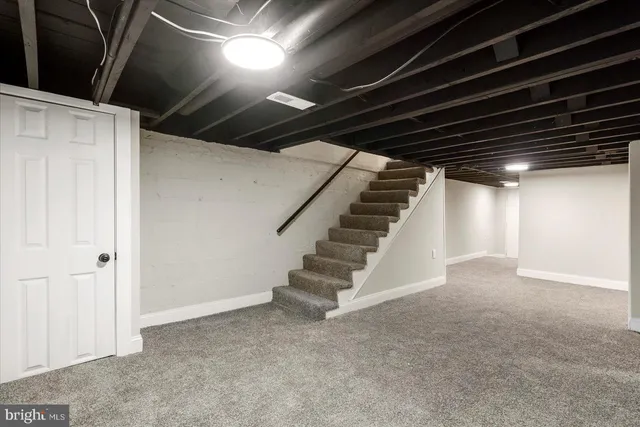 a view of an empty room with stairs