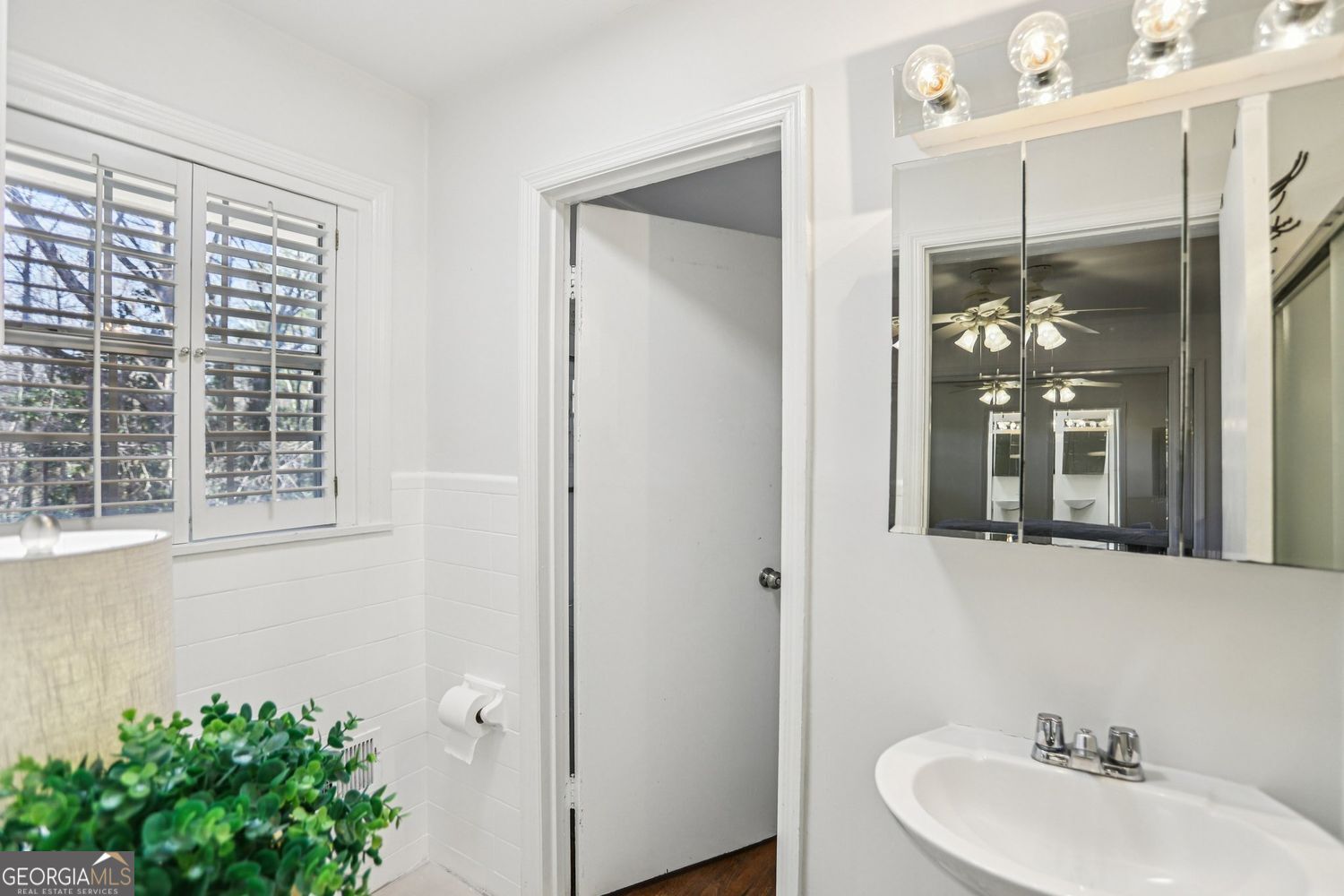 129 Tye Street Stockbridge, GA 30281 - Photo 12 of 27 a bathroom with a sink and mirror