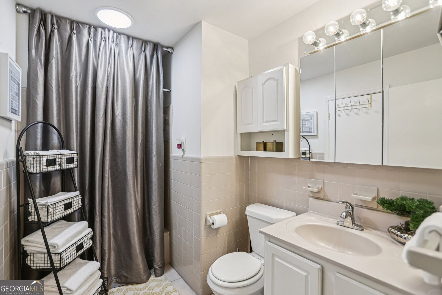 129 Tye Street Stockbridge, GA 30281 - Photo 15 of 27 a bathroom with a sink a toilet and mirror