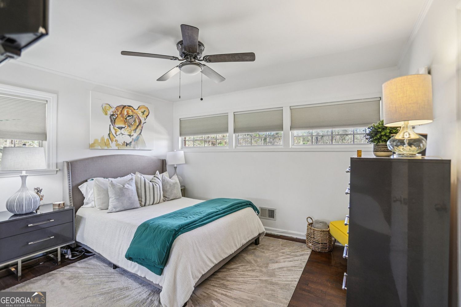 129 Tye Street Stockbridge, GA 30281 - Photo 16 of 27 a bedroom with a bed and dresser