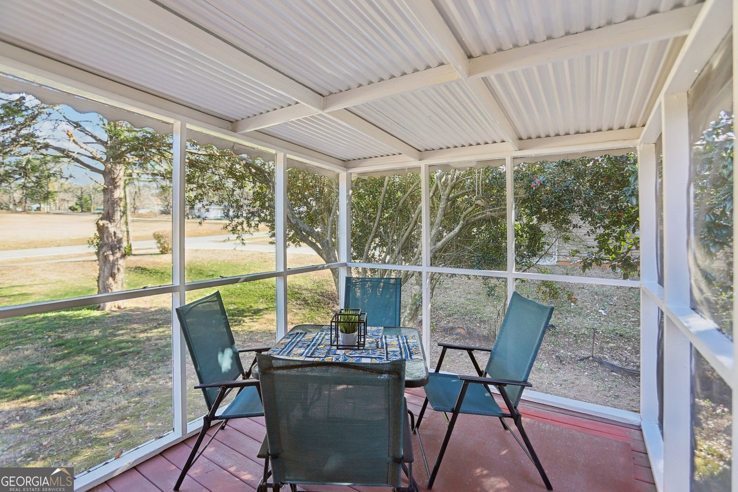 129 Tye Street Stockbridge, GA 30281 - Photo 21 of 27 a view of a porch with furniture and a yard