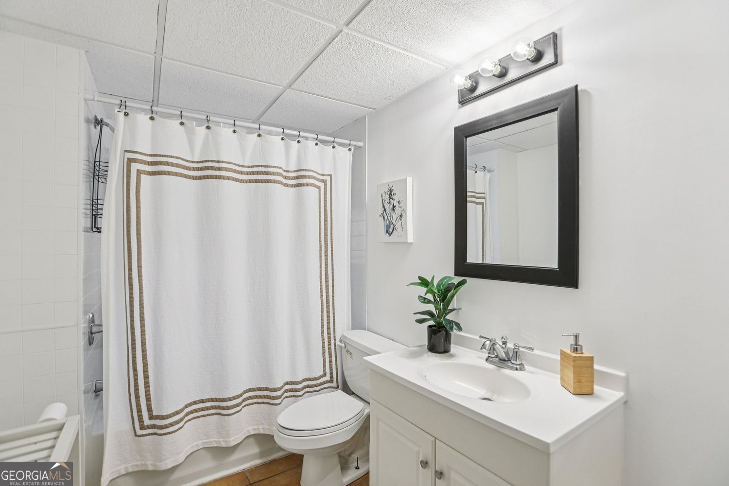 129 Tye Street Stockbridge, GA 30281 - Photo 10 of 27 a bathroom with a sink toilet and shower