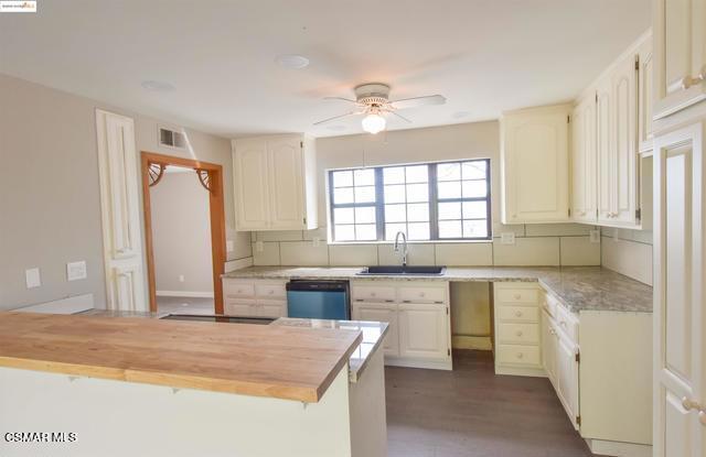13300 Lone Bend Road Jamestown, CA 95327 - Photo 13 of 50 a kitchen with stainless steel appliances granite countertop a sink stove and refrigerator