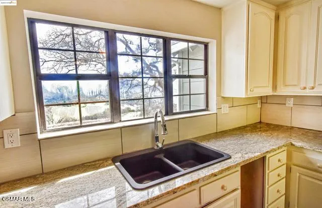 a view of an empty room with glass door