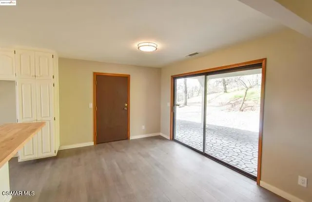 a view of an empty room and window