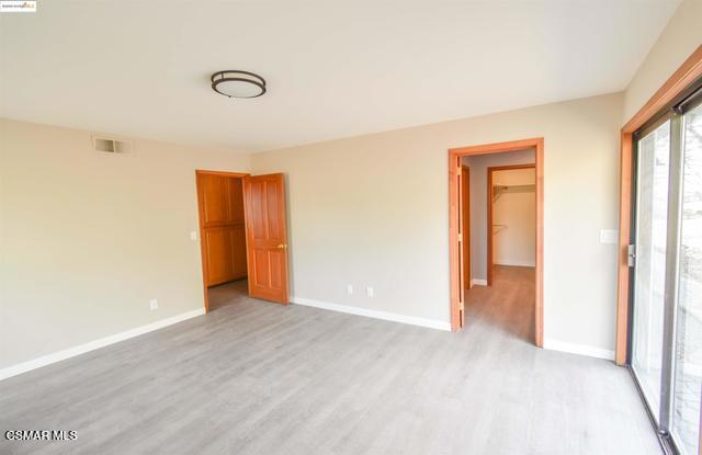 13300 Lone Bend Road Jamestown, CA 95327 - Photo 24 of 50 a view of an empty room with wooden floor and a window