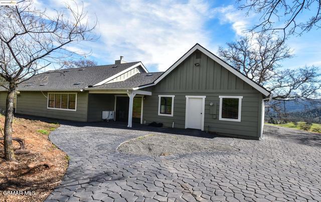 13300 Lone Bend Road Jamestown, CA 95327 - Photo 34 of 50 a front view of a house with a yard and garage