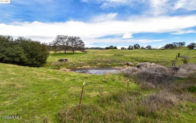 13300 Lone Bend Road Jamestown, CA 95327 - Photo 5 of 50 a view of a lake with houses in the background