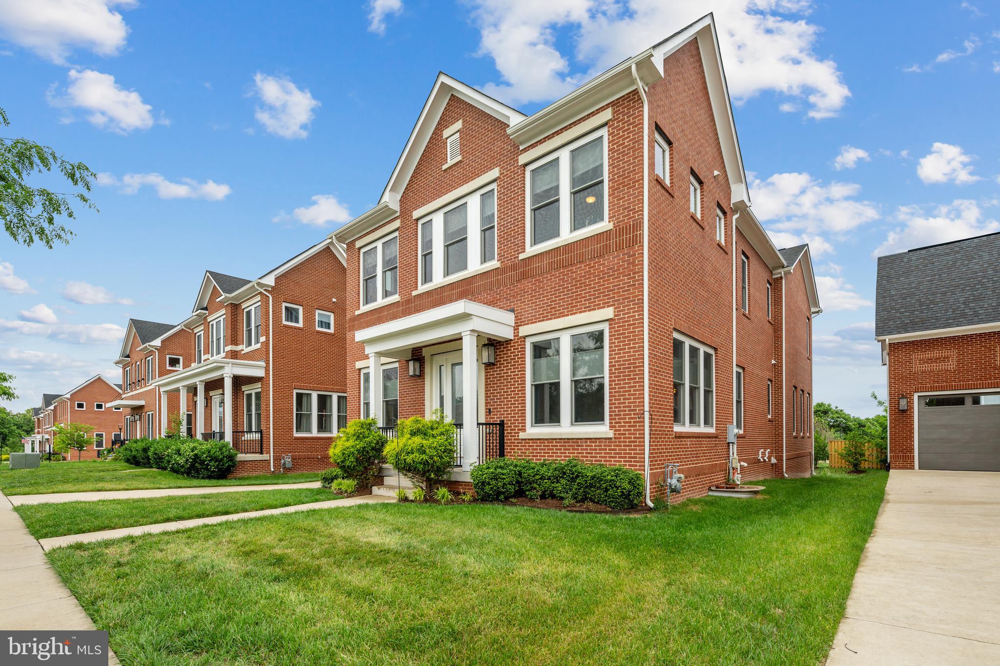 8459 Reformatory Way Lorton, VA 22079 - Photo 57 of 78 a front view of a house with a yard