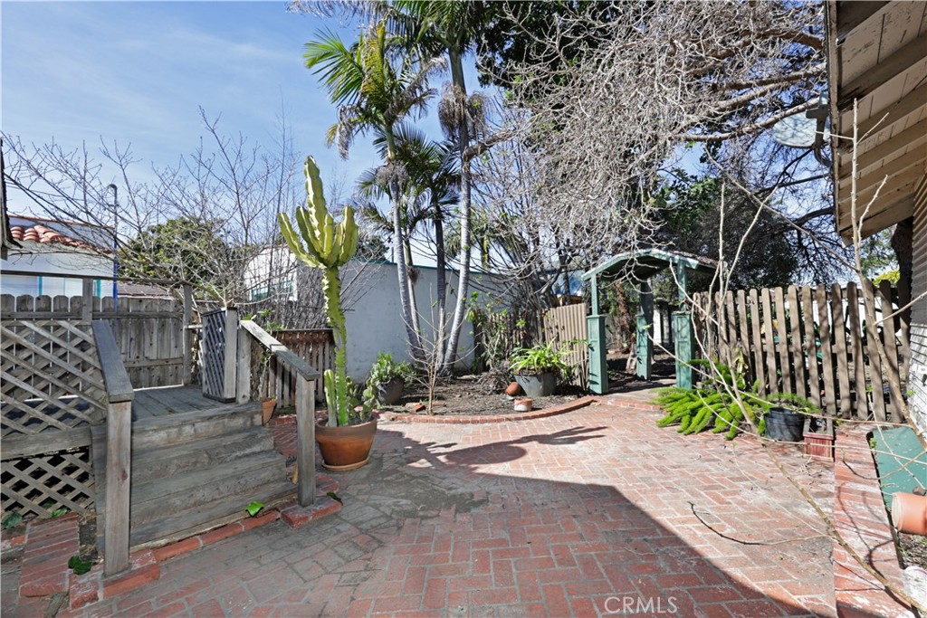 9211 Walnut Street Bellflower, CA 90706 - Photo 13 of 26 a view of a street with plants and trees