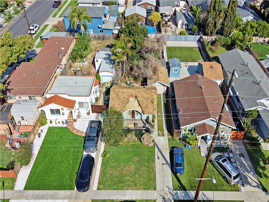 9211 Walnut Street Bellflower, CA 90706 - Photo 20 of 26 an aerial view of houses with outdoor space