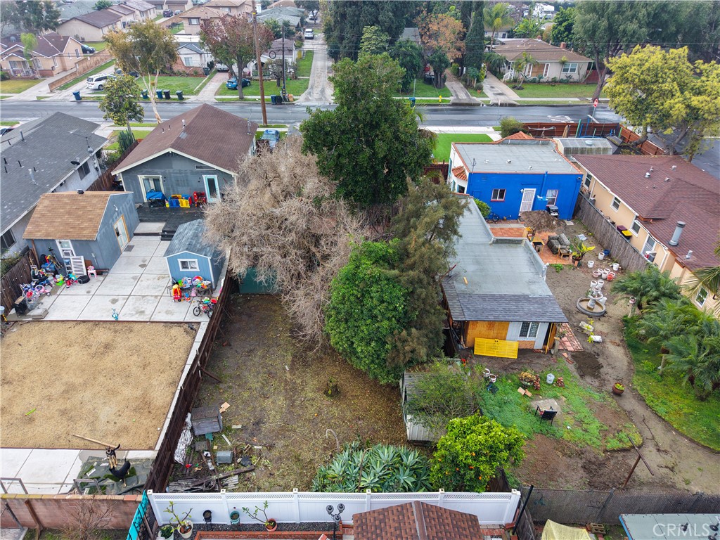 9211 Walnut Street Bellflower, CA 90706 - Photo 22 of 26 an aerial view of houses with yard