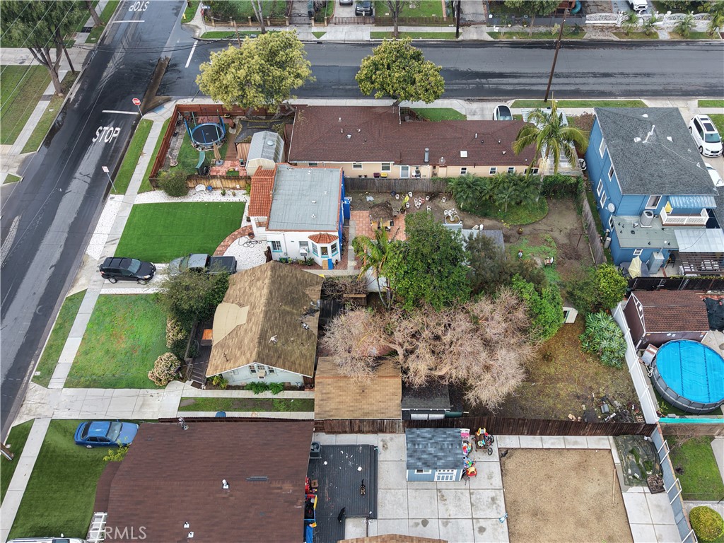 9211 Walnut Street Bellflower, CA 90706 - Photo 25 of 26 an aerial view of houses with outdoor space