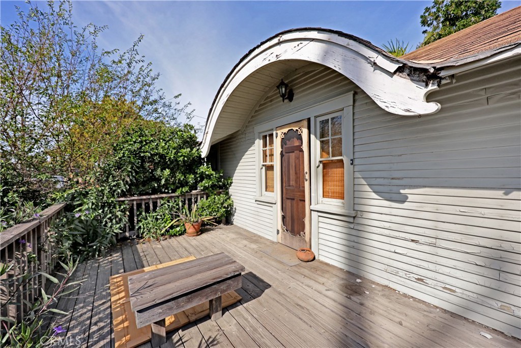9211 Walnut Street Bellflower, CA 90706 - Photo 4 of 26 a view of house with wooden floor and a potted plant