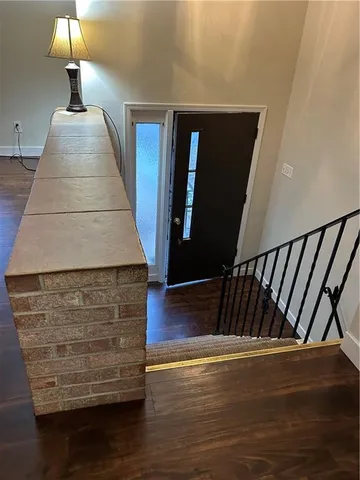 a view of room with window and wooden floor