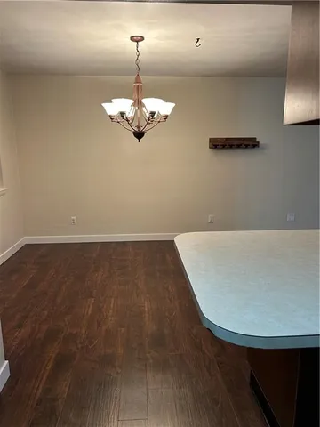 a kitchen with stainless steel appliances granite countertop a sink and a stove