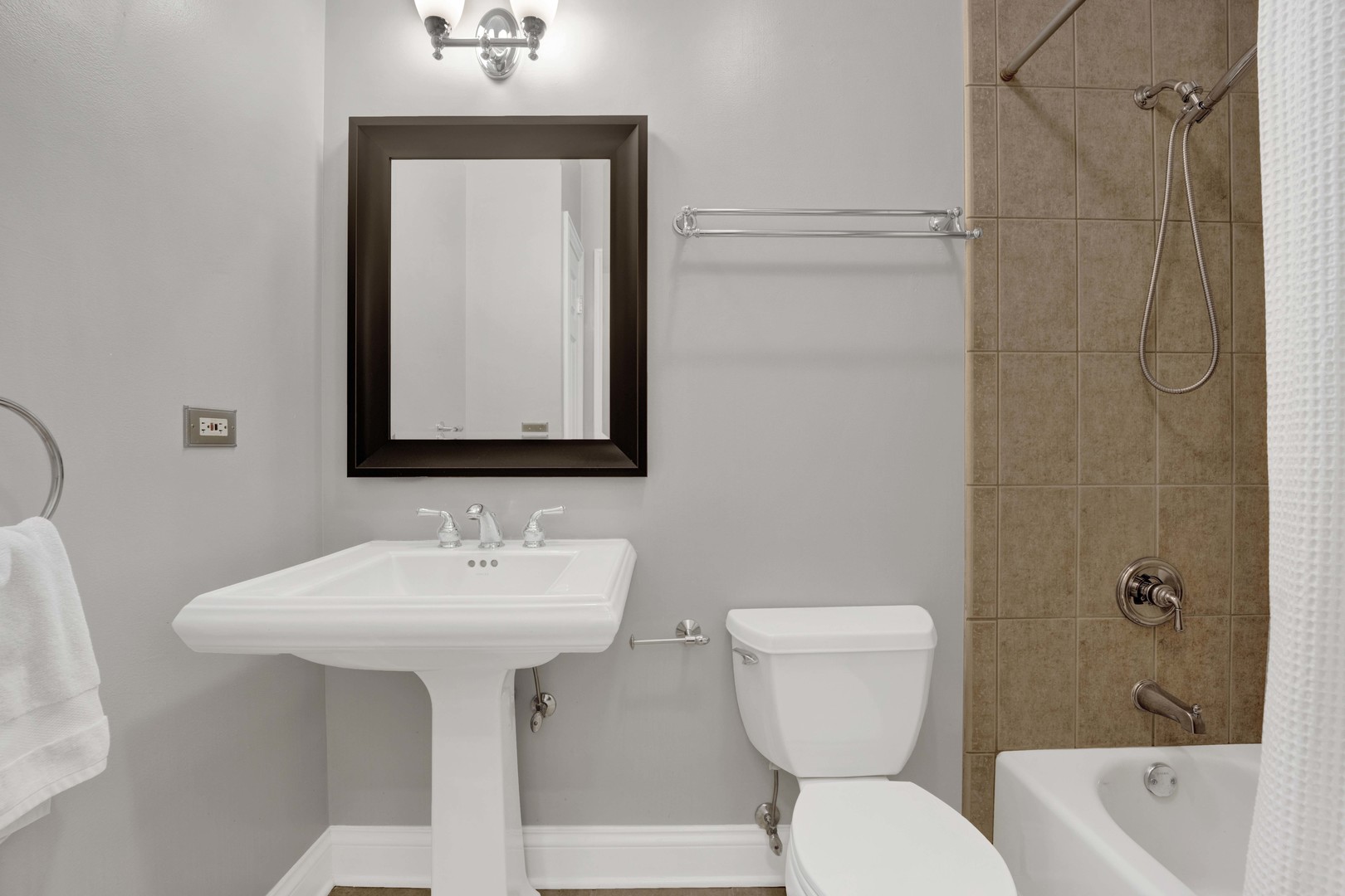 4543 North Malden Street, Unit 2N Chicago, IL 60640 - Photo 14 of 25 a bathroom with a toilet sink and mirror