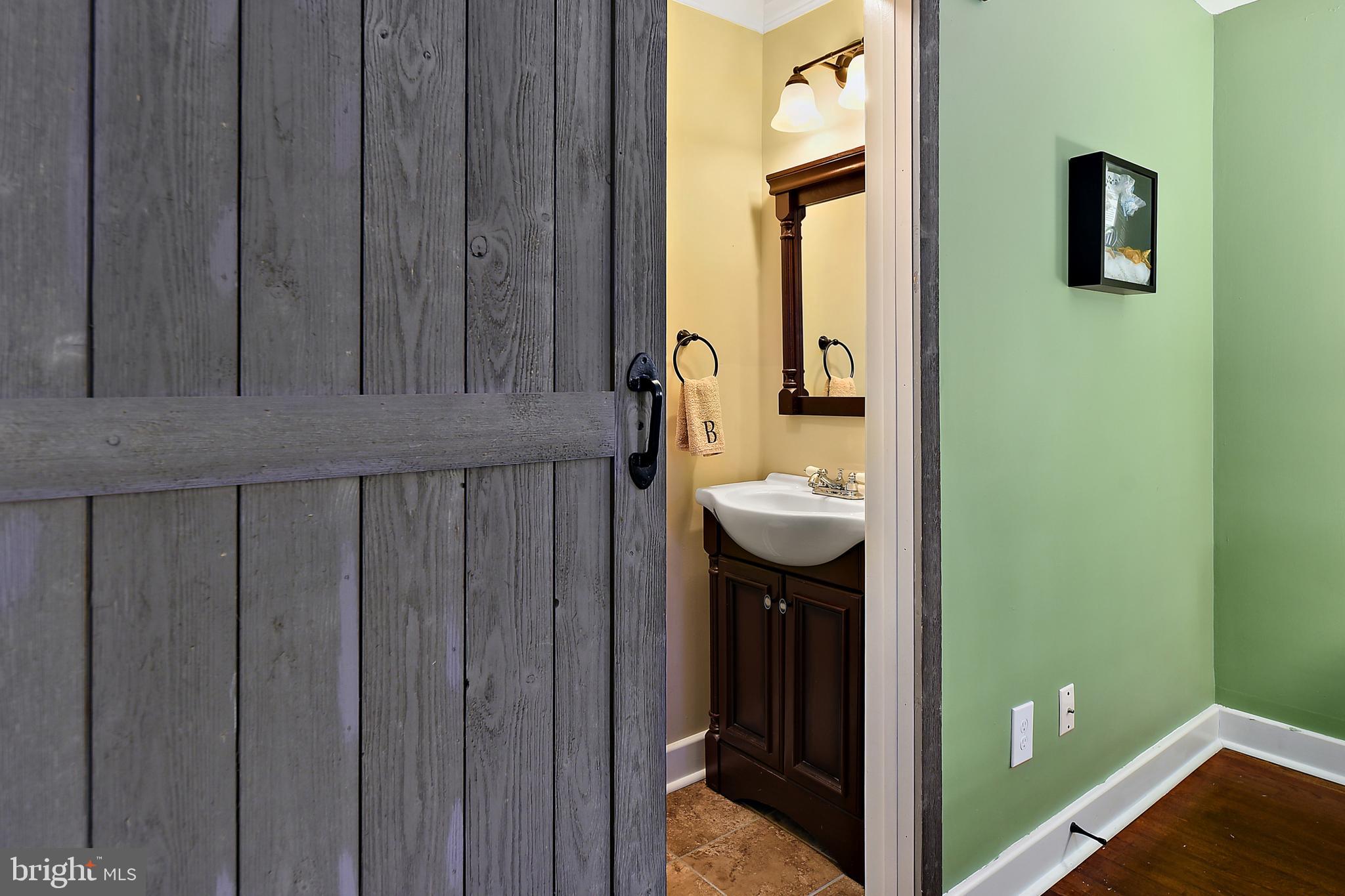 10045 Friendship Road Berlin, MD 21811 - Photo 31 of 45 Barn Door in Master Bedroom into Bathroom