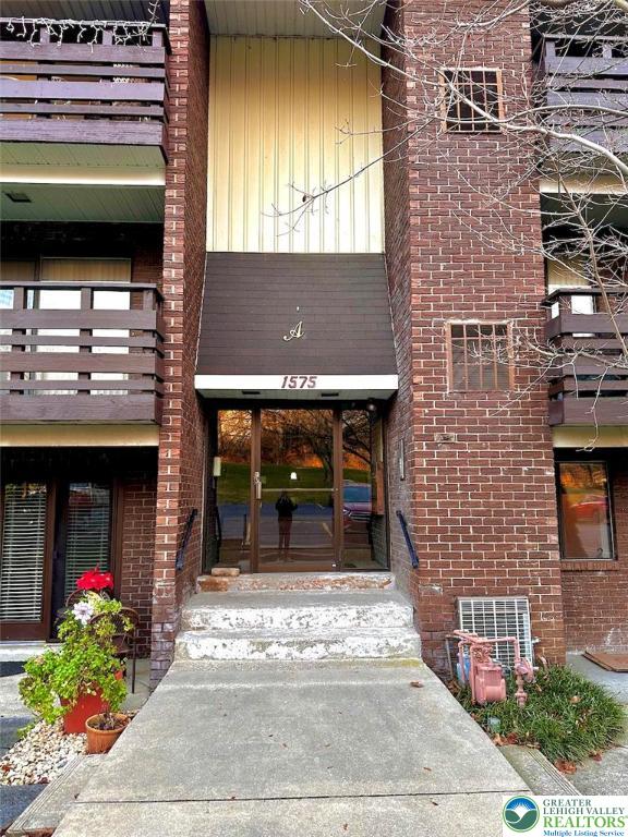 1575 Creekside Road, Unit A2 Whitehall, PA 18052 - Photo 21 of 21 a front view of a house with a garden