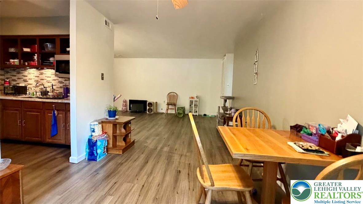 1575 Creekside Road, Unit A2 Whitehall, PA 18052 - Photo 6 of 21 a dining room with furniture and wooden floor