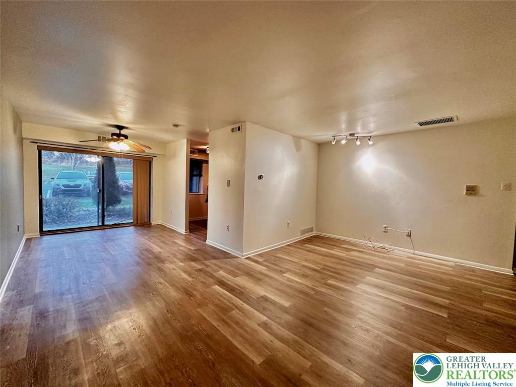 1575 Creekside Road, Unit A2 Whitehall, PA 18052 - Photo 7 of 21 a view of empty room with wooden floor