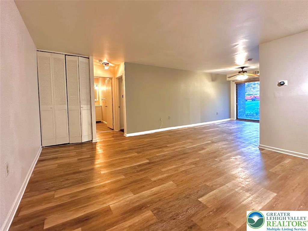 1575 Creekside Road, Unit A2 Whitehall, PA 18052 - Photo 8 of 21 a view of an empty room with window and wooden floor