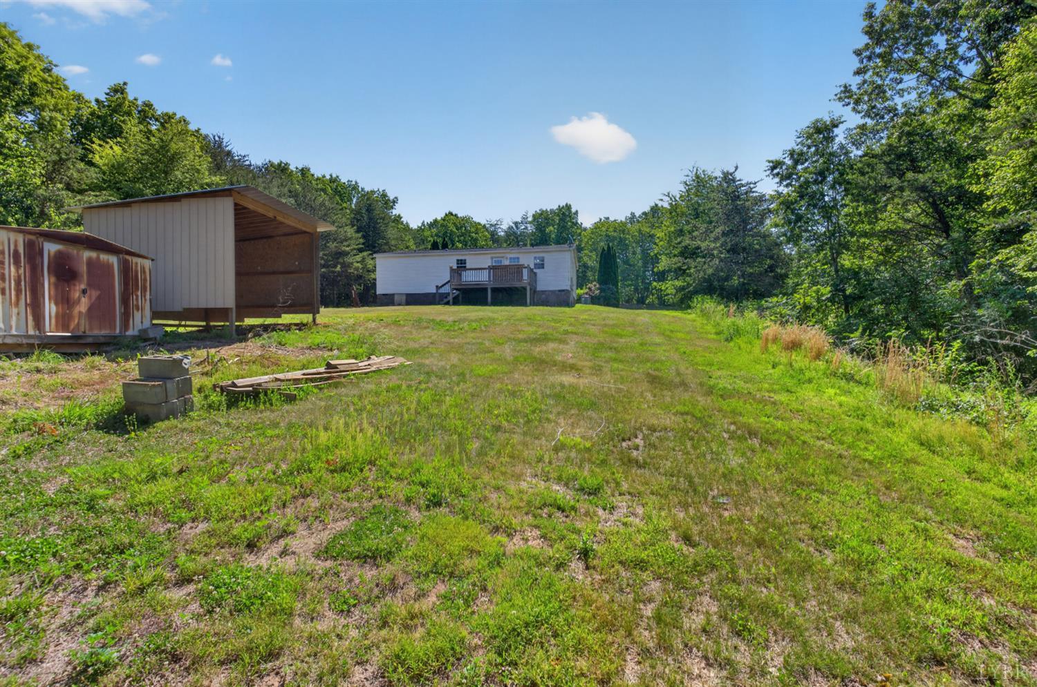 1811 Mohawk Road Gladys, VA 24554 - Photo 35 of 51 a backyard of a house with a yard and outdoor seating