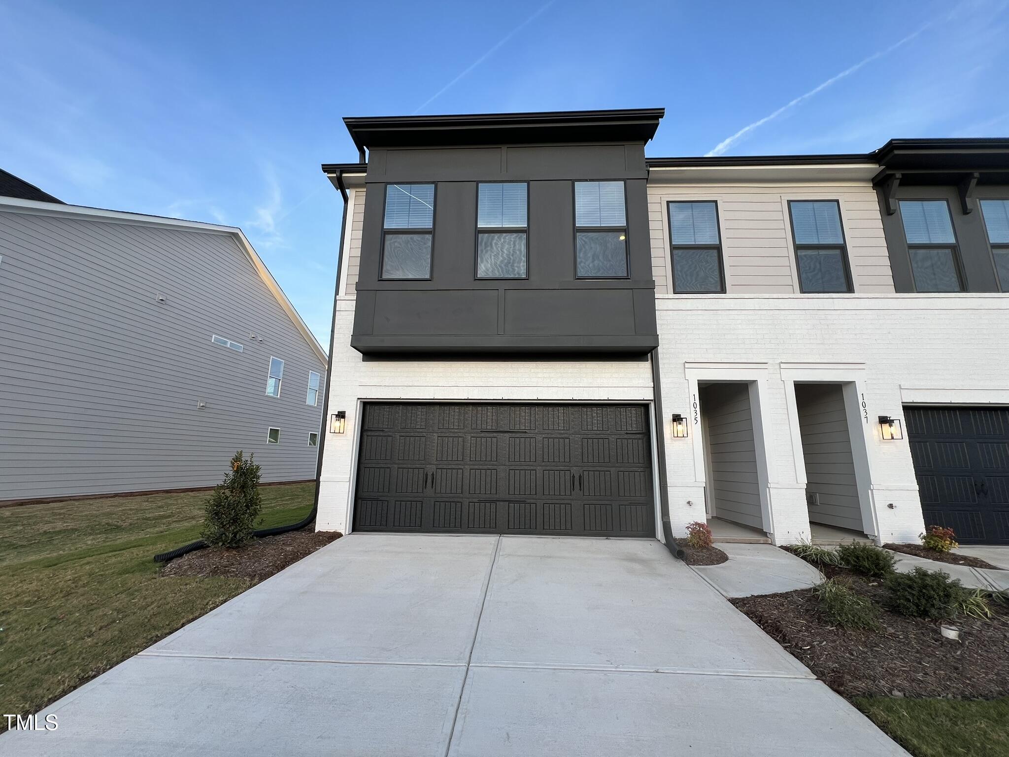 1035 Westerland Way, Unit 45 Durham, NC 27703 - Photo 1 of 27 a front view of a house with garden