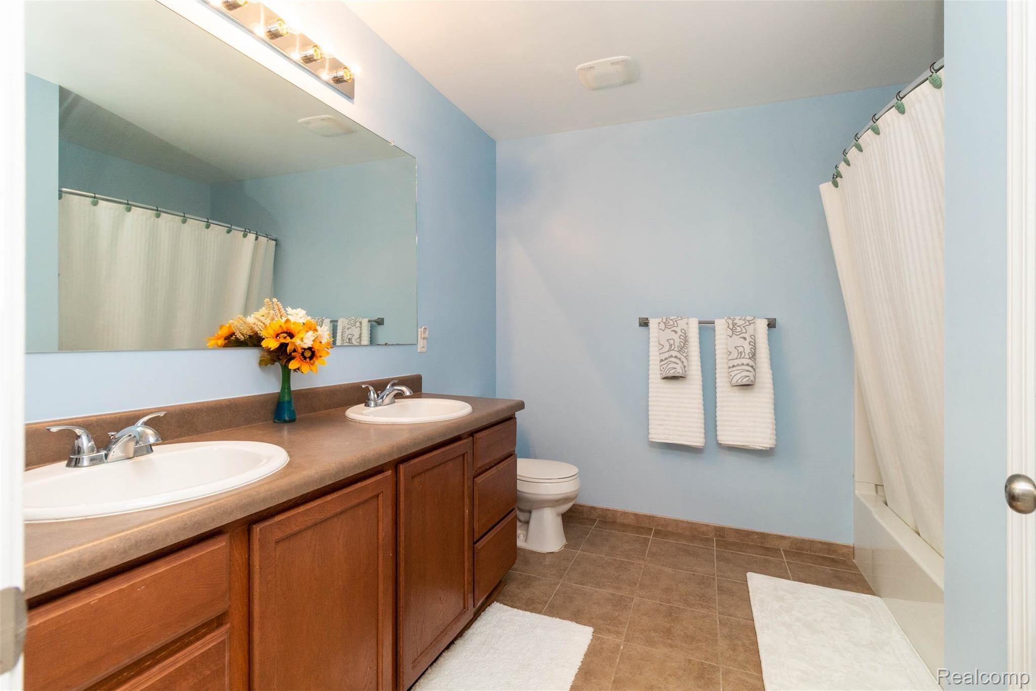 1165 Risen Star Way Howell, MI 48843 - Photo 33 of 47 Master bath with his and hers sinks