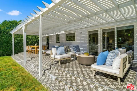 a view of a chairs and table in a yard