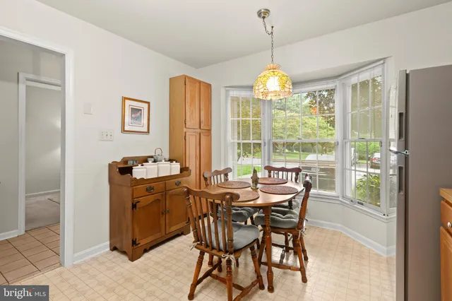 a view of a dining room with furniture wooden floor and chandelier