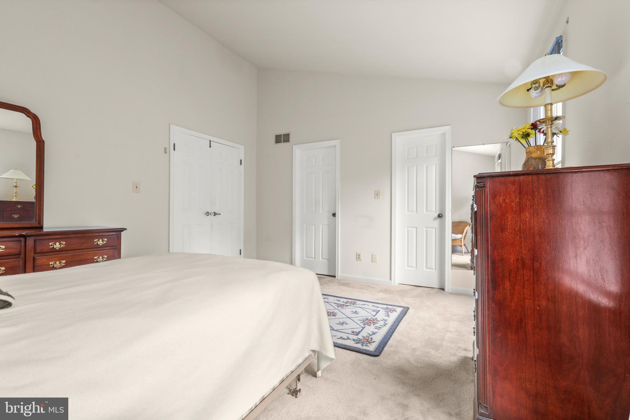 741 Burgh Westra Way Abingdon, MD 21009 - Photo 26 of 48 a spacious bedroom with a bed and a lamp