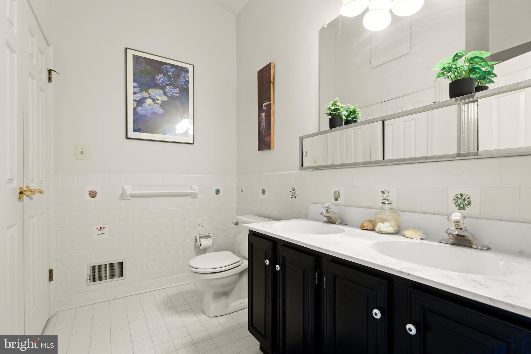 741 Burgh Westra Way Abingdon, MD 21009 - Photo 27 of 48 a bathroom with a sink a toilet and mirror