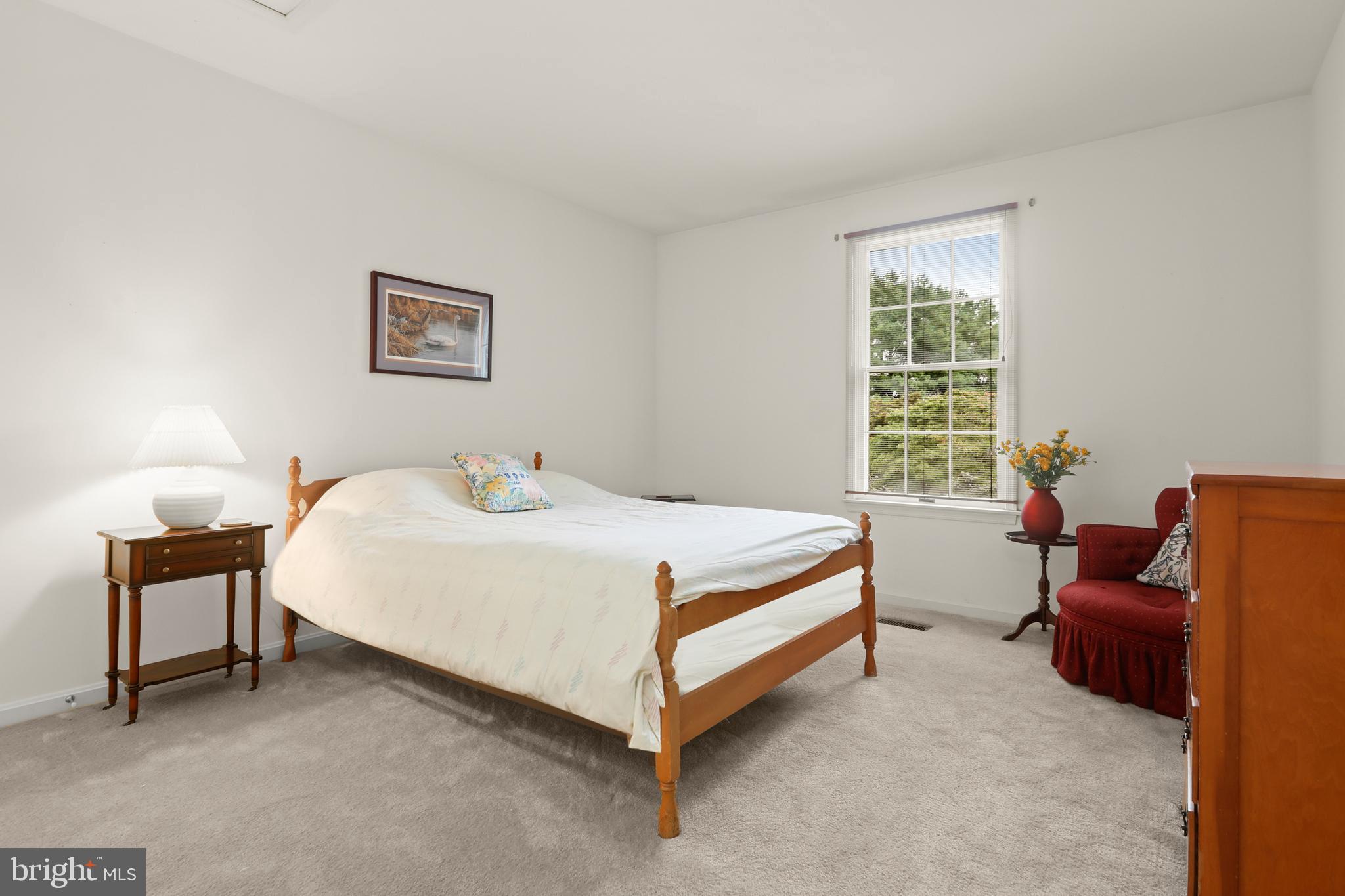 741 Burgh Westra Way Abingdon, MD 21009 - Photo 32 of 48 a bedroom with a bed and a couch next to a window