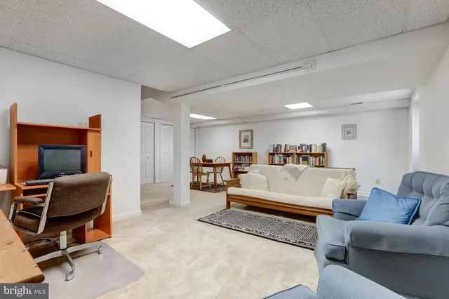 a bathroom with a sink mirror and toilet